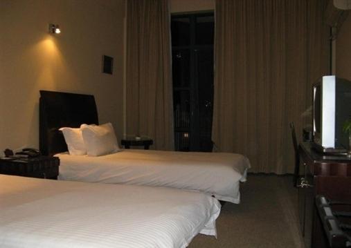 Baolong Homelike Hotel - Wusong Branch Sanghaj Szoba fotó